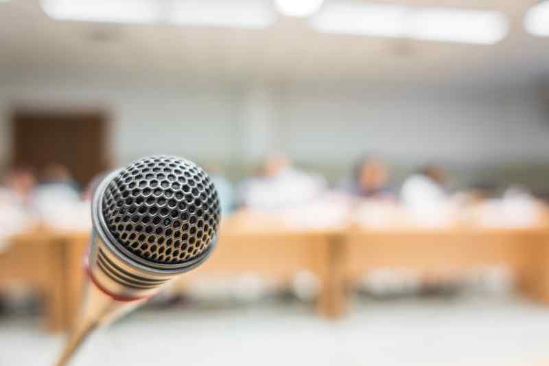 Black microphone in conference room filtered image processed v